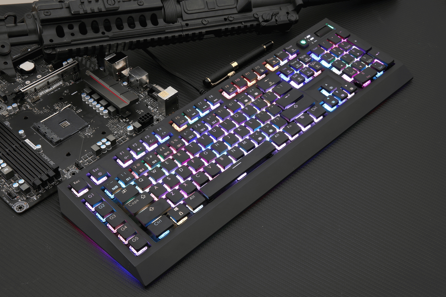 A mechanical keyboard key bounce illustrated with a colorful RGB backlit keyboard beside a motherboard