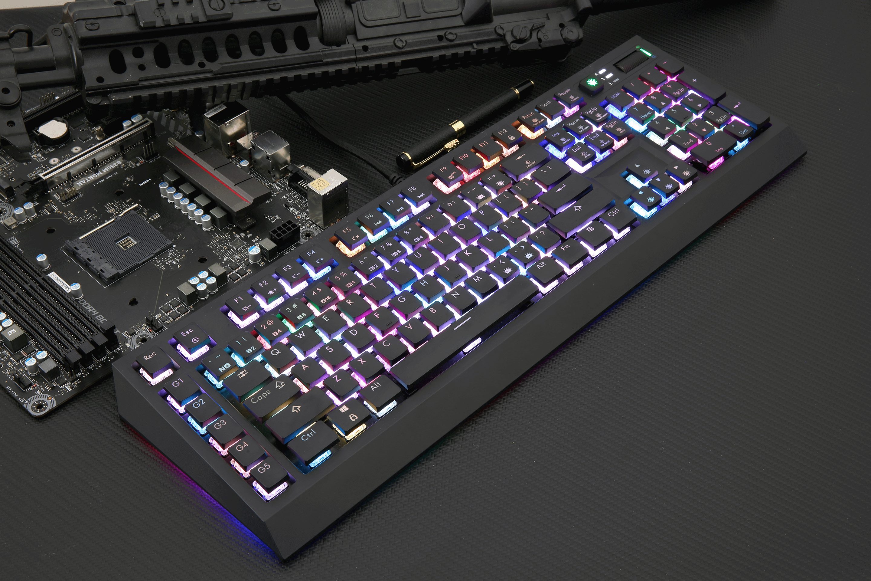 A mechanical keyboard key bounce illustrated with a colorful RGB backlit keyboard beside a motherboard