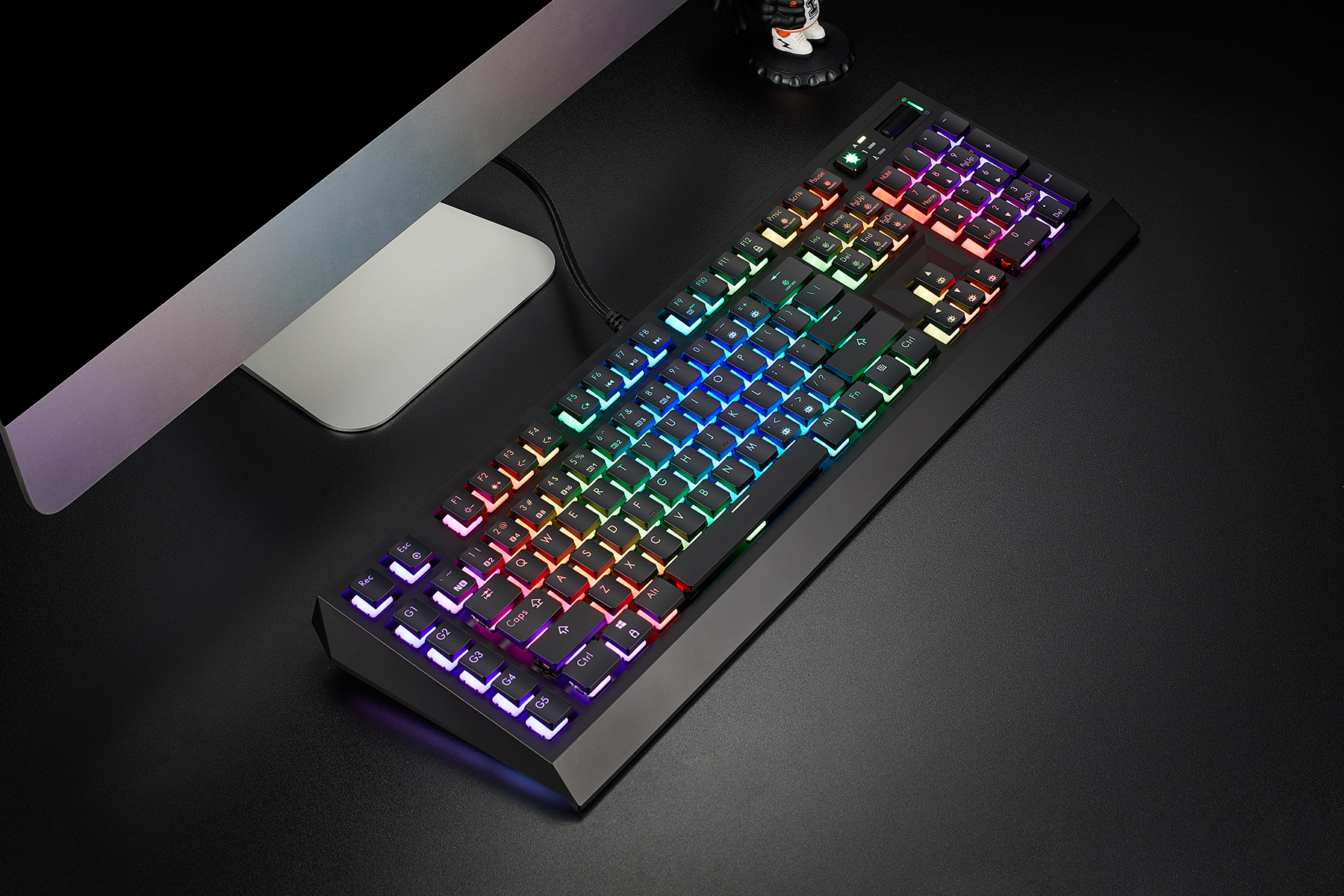 Wired vs wireless gaming keyboards comparison with a colorful RGB-lit wired gaming keyboard on a dark surface